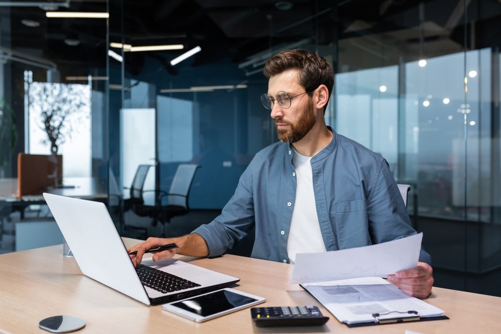 man with computer possibly doing ai task